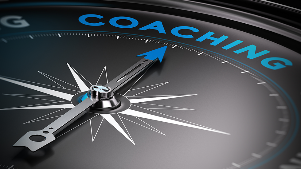 photo of a compass pointing towards coaching